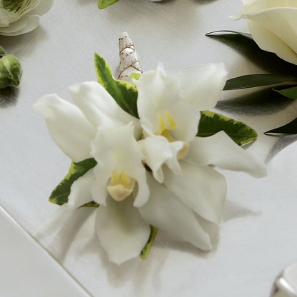 White Mini Cymbidium Boutonniere – AMCS FLOWERS & PERSONAL SERVICES LLC, Chesapeake VA